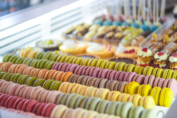 Pastry shop glass display with selection of sweets and cakes. Confectionery shop display...