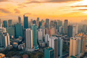 Beautiful sunset of Skyscrapers and shopping malls in Makati, Philippines Metro Manila region and...