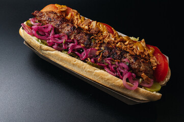 Baguette sub sandwich with lamb kebab