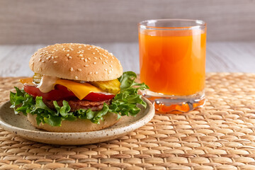 Delicious and healthy burger and fruit juice for breakfast and lunch. Homemade recipe. Fast food....