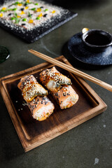 Spring rolls with salmon, shrimp and eel