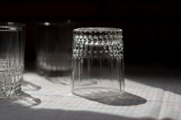 Glass beakers. Transparent glass on the table.