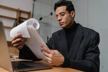 Mid aged brunette man entrepreneur in suit