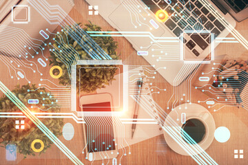 Double exposure of technology theme drawing over work table desktop. Top view. Global data analysis concept.