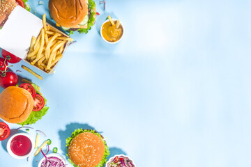 Various burgers set on blue background