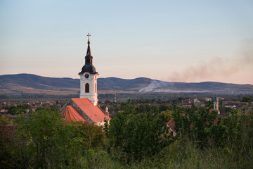 Panorama of the small town of Bela Crkva in Serbia with the Romanian mountains in the background and the White Church in the foreground, which is a symbol of the city.