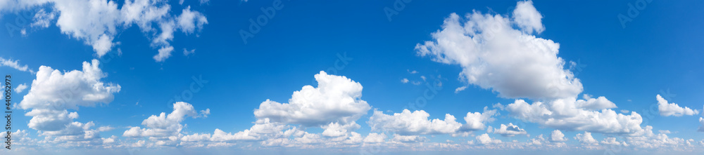 Wall mural blue sky background with tiny clouds. panorama background