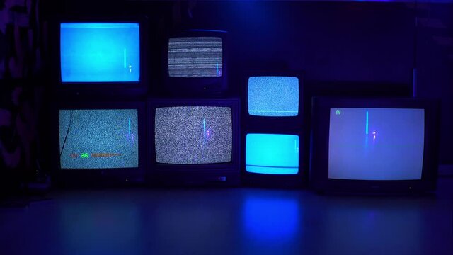 Different variants of No signal on old TV screens on a dark background