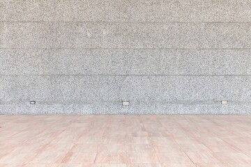 Gray polished sandstone walls and brown ceramic tile floors