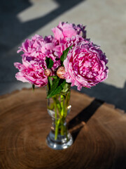 Beautiful bouquet of pink peonies in vase