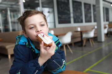 Child eating Eclair