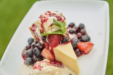 A Beautifully Crafted Slice of Cheesecake with Berry Sauce on Top