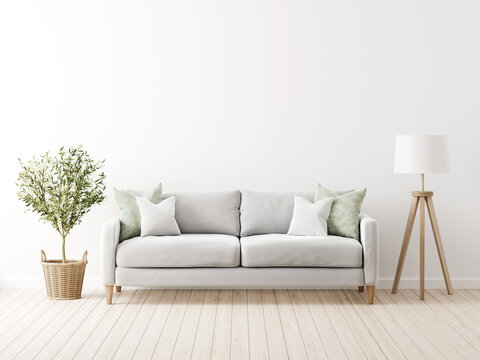 Traditional living room interior mockup with grey sofa and green pillows by olive tree in wicker basket and floor lamp on empty white wall background. 3d rendering, illustration