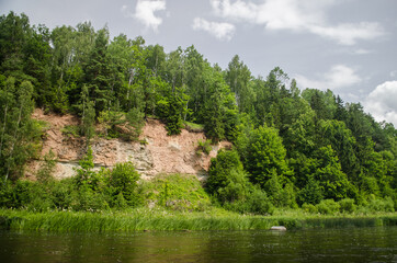 Naklejka na ściany i meble Sandstone cliffs on the banks of the Venta River, Latvia.
