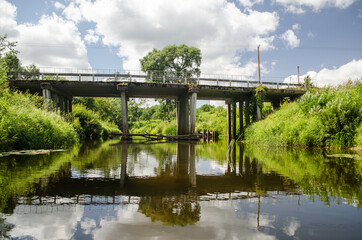 Fototapeta na wymiar Concrete bridge over the river Ciecere, Latvia.