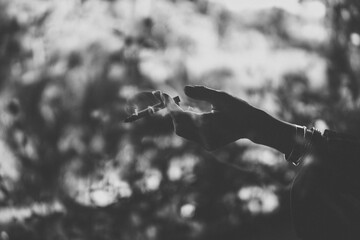 The cigarette in woman hand.