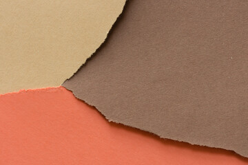 Fototapeta premium ripped paper background in analogous colors (orange sand brown)