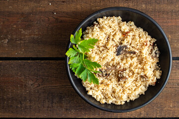 couscous no meat vegetable spices appetizer portion dish on the table healthy food meal snack copy space food background rustic top view 