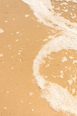 Soft  ocean wave on sandy beach..
