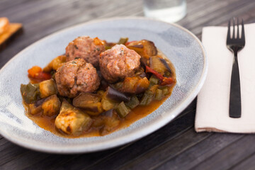 steamed meatballs with stewed vegetables with haze on plate