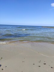 Baltic Sea view from Svetlogorsk, Kaliningrad region. Sandy beach with rocks. Waves of the sea.