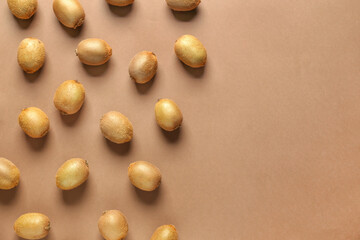 Many ripe kiwi on color background