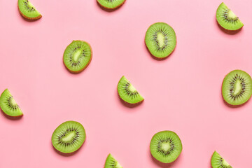Cut ripe kiwi on color background
