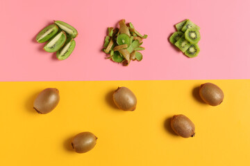 Composition with ripe kiwi on color background
