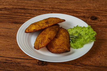 Baked potato with herbs and spices