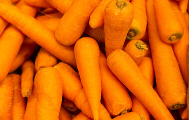 Fresh organic carrots as a close-up background. Seamless carrot pattern