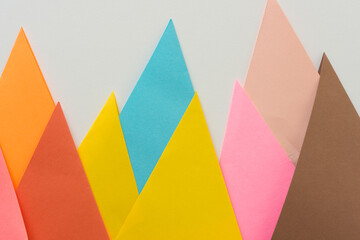 triangle-shaped folded construction paper backgrounds - paper mountains on white