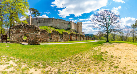 Ruins of Boskovice castle - view of surrounding walls and tower. Summer day, blue sky. Tourism in...