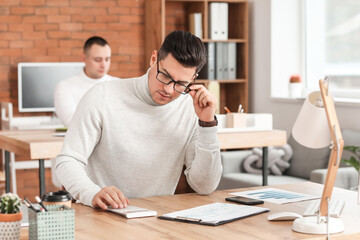 Male accountant working in office