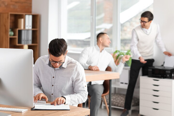 Male accountant working in office