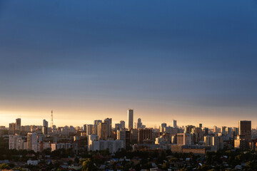 Fototapeta na wymiar Dawn clouds over the metropolis on storm