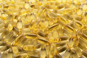 Fish oil. Pile of capsules Omega 3 background. Close up, top view