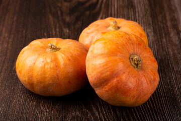 Pumpkins on the wooden table.