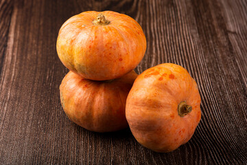 Pumpkins on the wooden table.