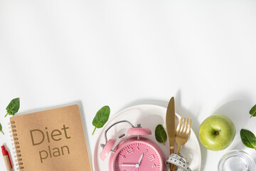 Composition with cutlery, measuring tape, diet plan and alarm clock on color background. Diet...