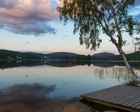Beautiful sunset over V&aring;gsfj&auml;rden lake in the North of Sweden. Reflections in the water
