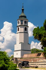 Obraz premium Historic Clock tower (Sahat kula) of the Belgrade Fortress Kalemegdan, with displayed old artillery gun