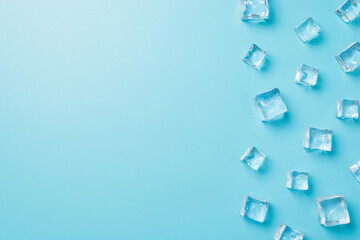 Fototapeta na wymiar Above photo of transparent cubes ice isolated on the blue background with copyspace