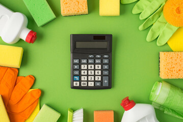 Top view photo of calculator in the middle detergent gel bottles rubber gloves napkins scouring...
