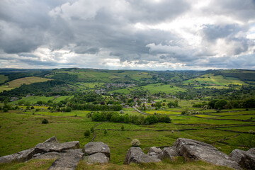 Fototapeta na wymiar Luscious green valleys in England and cloudy sky 