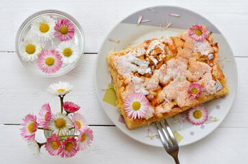 still life with homemade cakes and flowers flat lay