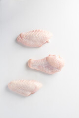 raw chicken wings white background. flat lay