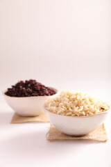 Organic boiled brown rice on bowl isolated in white background