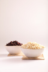 Organic boiled brown rice on bowl isolated in white background