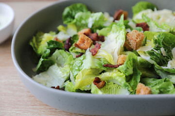 caesar salad appetizer on wooden background