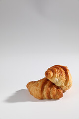 Croissant isolated in  wihite background with sunny light